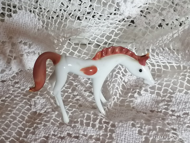 Graceful, white glass foal, pony