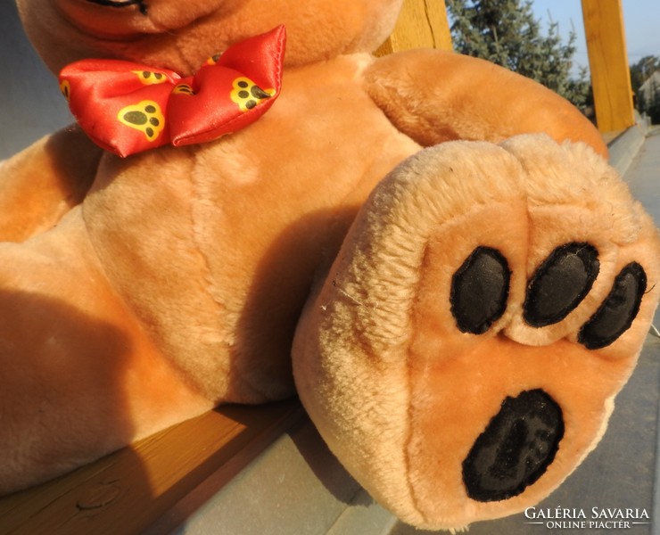 Huge teddy bear with teddy bear and bow tie