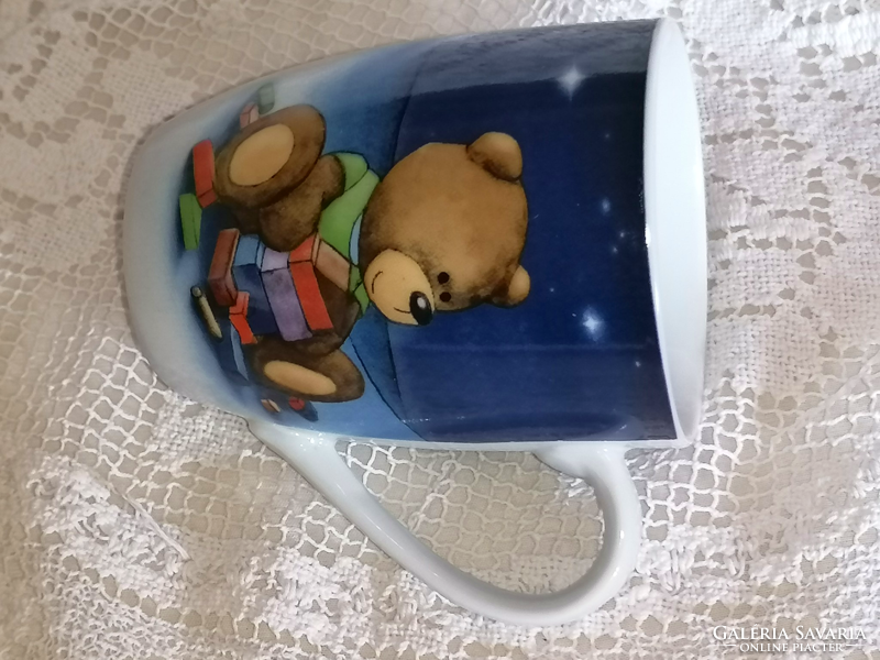 Lovely teddy bear in porcelain mug and cup