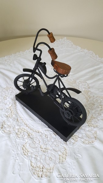 Marks & spencer design, metal bicycle mockup on wooden pedestal