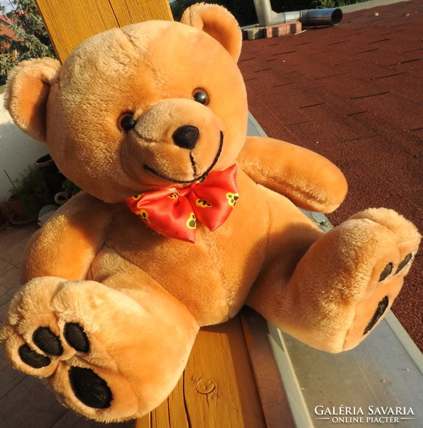 Huge teddy bear with teddy bear and bow tie