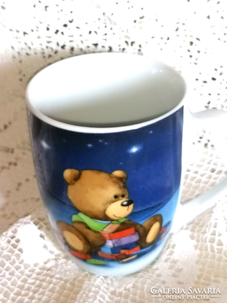 Lovely teddy bear in porcelain mug and cup