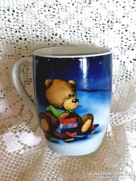 Lovely teddy bear in porcelain mug and cup