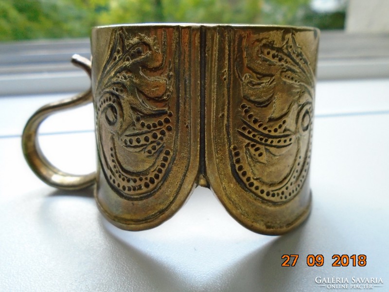 Art Nouveau flower motif with curved shapes, cast bronze cup holder