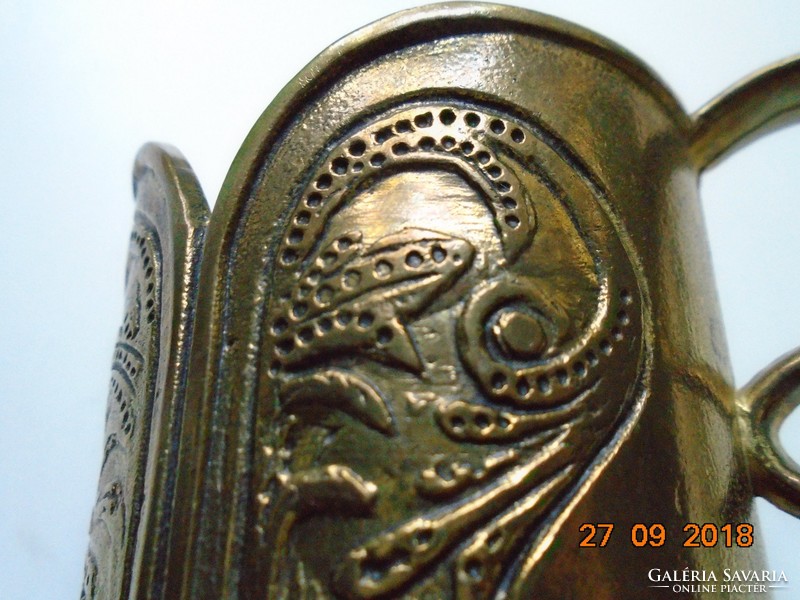 Art Nouveau floral motif with curved shapes, bronze cup holder