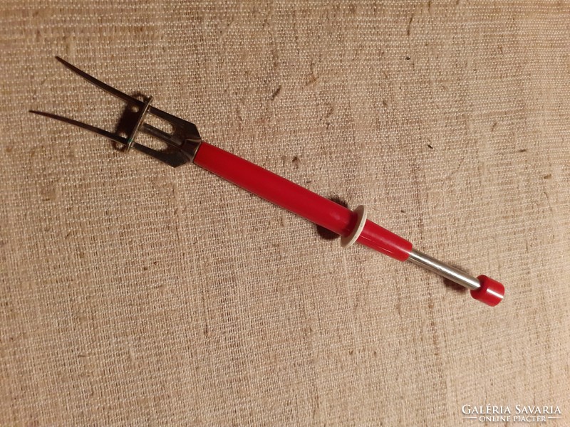 Nice condition spring meat needle with red plastic handle