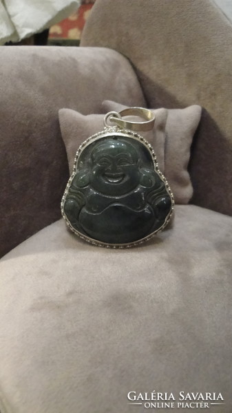 Silver pendant with nephrite stone carving