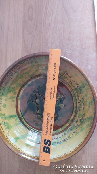 An interesting unique ceramic plate with an inscription in the vending machine