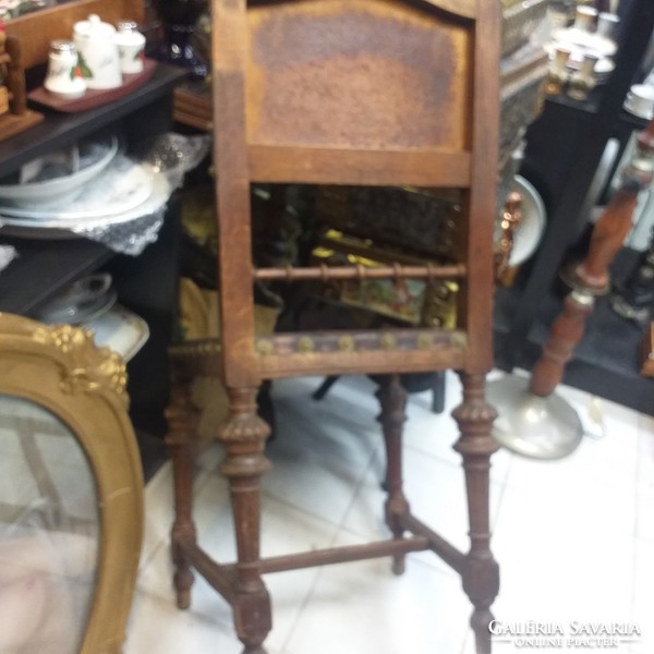 Antique printed leather wooden chair.
