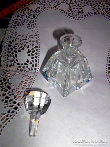 Polished glass bottle with polished stopper.