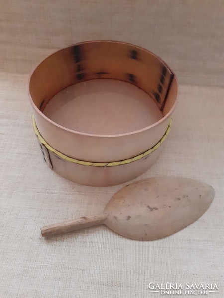 Old kitchen wooden framed flour sieve with floured wooden spoon