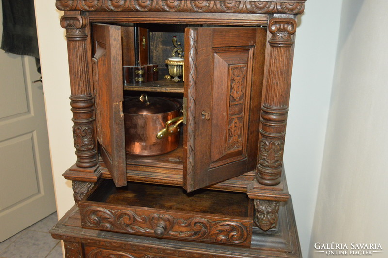 Richly carved antique French cabinet with cabinet drawer
