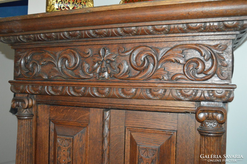 Richly carved antique French cabinet with cabinet drawer