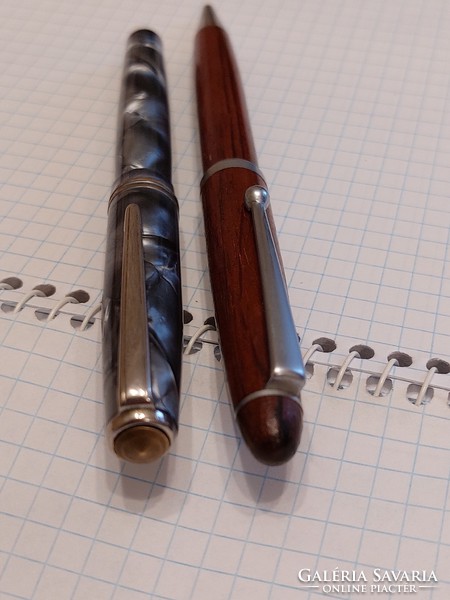 Fountain pen and rosewood pen in leather case.