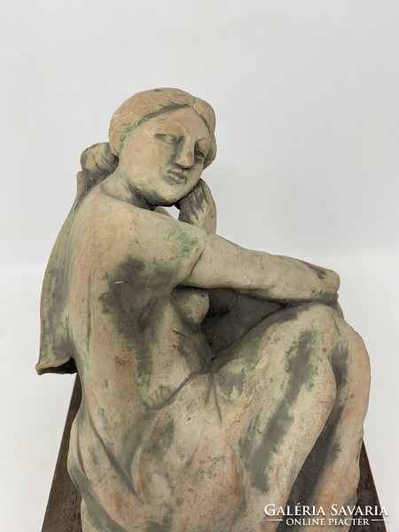 Ceramic statue of a thoughtful female sitting on the floor, leaning on her palm - cz