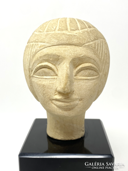 Ceramic statue depicting an Egyptian head on a glass pedestal - cz