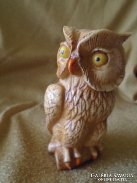 A lifelike serious owl with a bone or bone effect