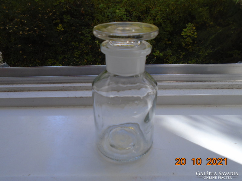 Marked pharmacy glass with polished solid glass stopper