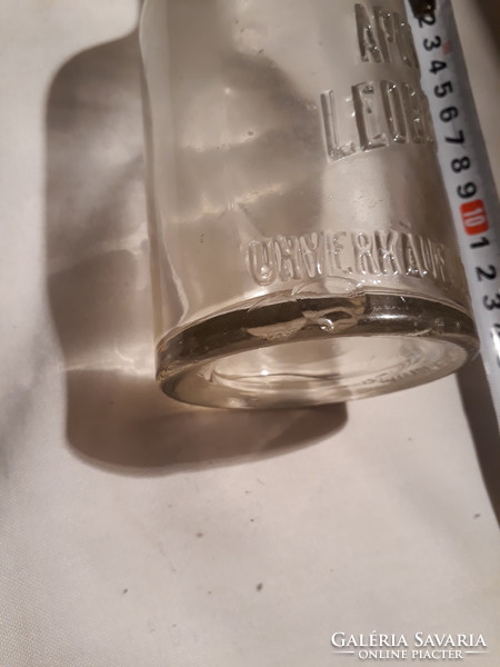 Old foreign, buckled pharmacy glass