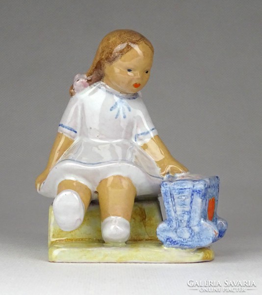 1G330 baby rocking marked little girl ceramic figurine