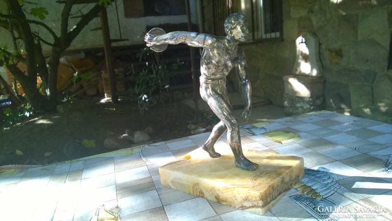 Discus thrower statue on a marble base