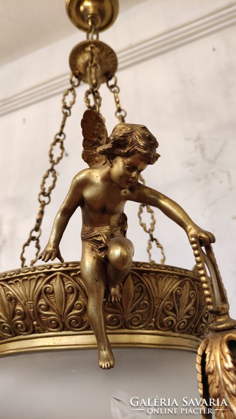Bronze chandelier, putto ornament made of bronze and glass judge.1900 Years.