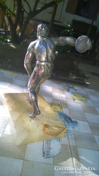 Discus thrower statue on a marble base