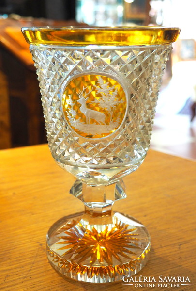 Polished glass cup decorated with deer motif