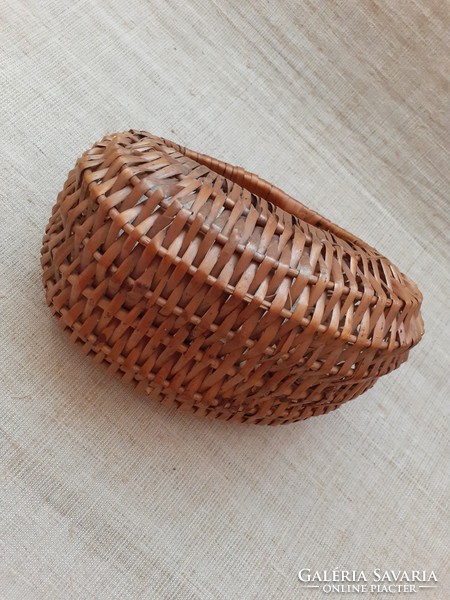 Little girl with wicker basket made of old spare handicrafts