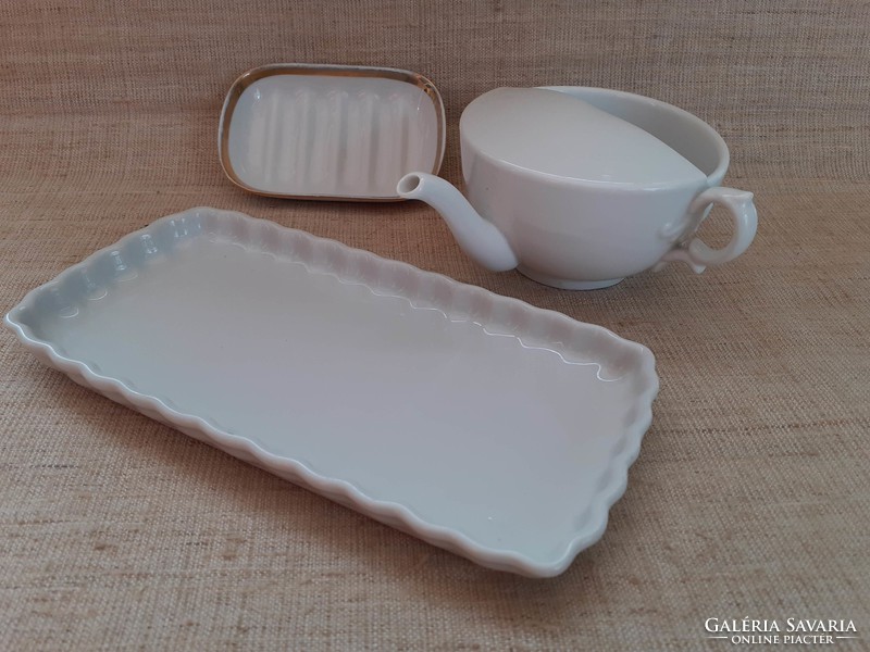 Old white porcelain drinking cup with gilded edge soap dish on porcelain tray in one