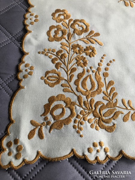 Hand embroidered on a pale yellow background mustard color matyo pattern small tablecloth 33 cm