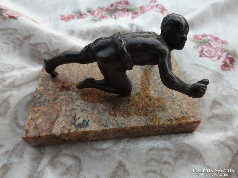 Athlete - bronze statue on a marble pedestal