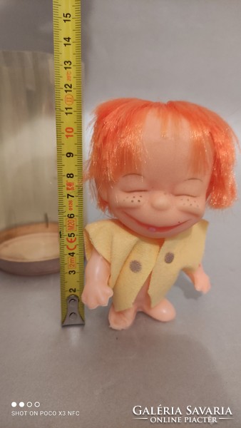 Vintage red-haired rubber doll in a hanging car mascot box