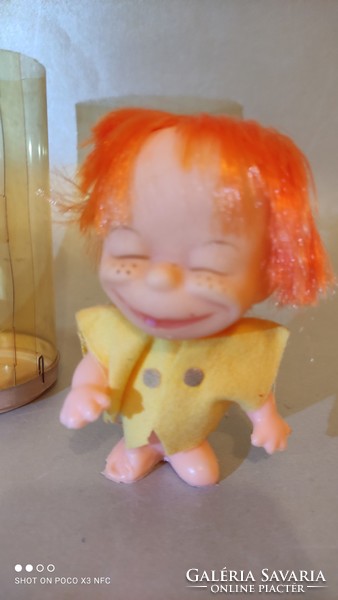 Vintage red-haired rubber doll in a hanging car mascot box