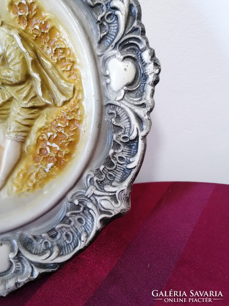 Romantic scene with plaster wall ornament plate