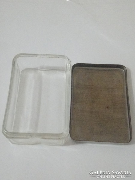 Glass box with old metal lid.