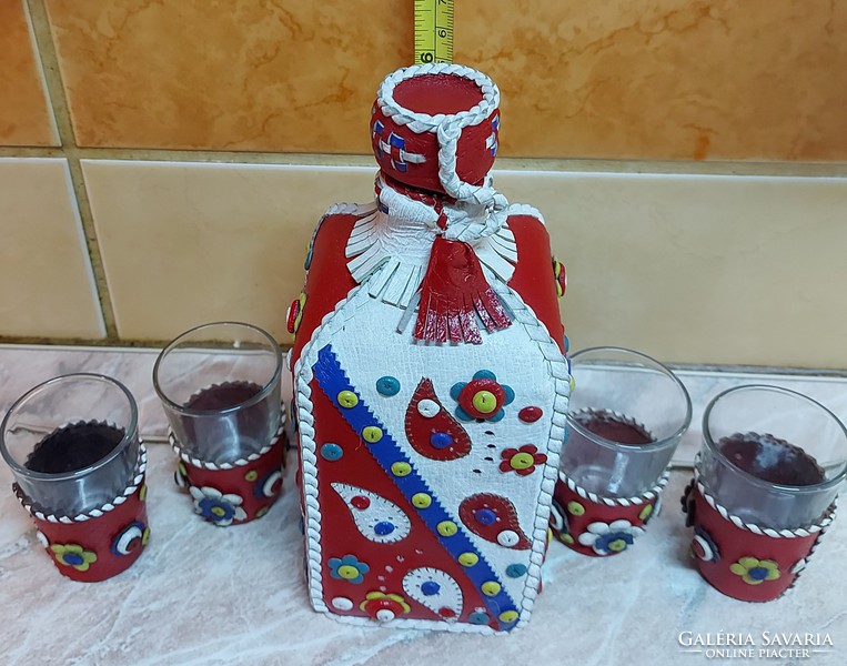 Set of handcrafted liqueurs covered with colored leather.