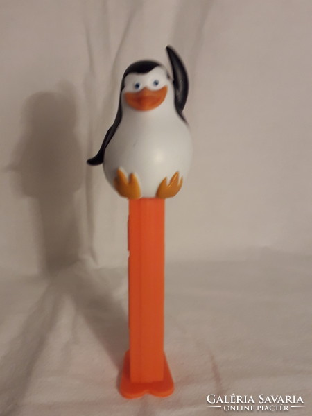 Seven different pez figures along with penguins and the others in the other pictures