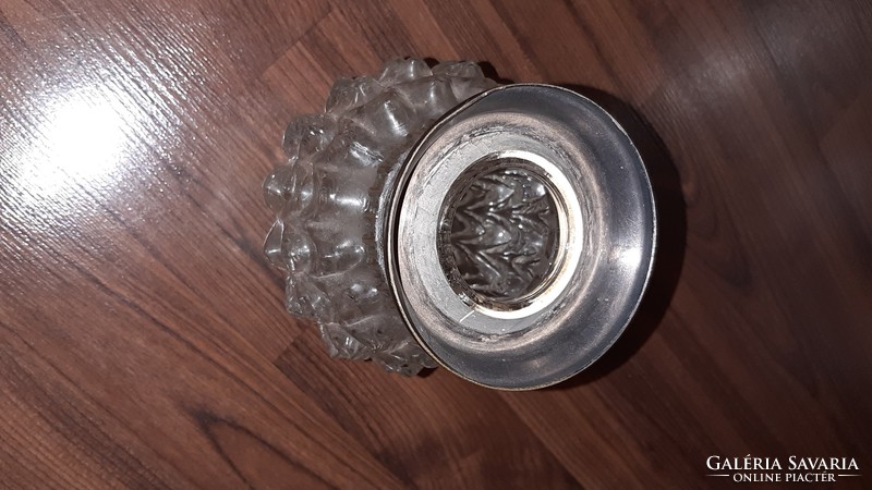 Glass vase with a metal rim or the envelope of something