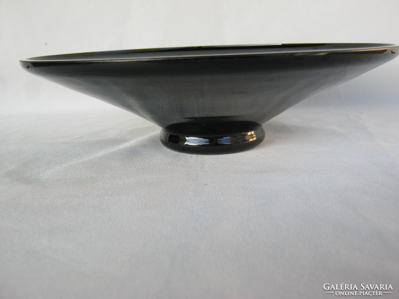 Retro ... Black glass bowl with colorful patterns as a table centerpiece