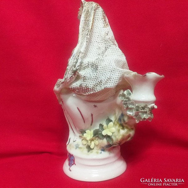 Porcelain figurine with a candlestick pierced with Madonna's child.