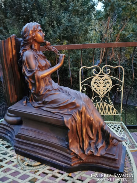 The lady received a rose - a monumental bronze statue