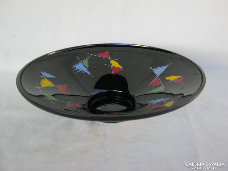 Retro ... Black glass bowl with colorful patterns as a table centerpiece