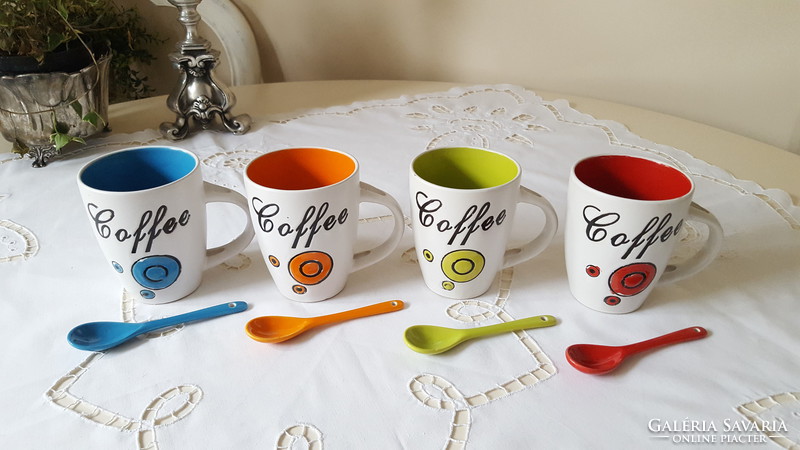Colorful coffee ceramic mugs with spoons