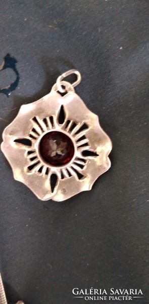 Silver pendant with garnet stones