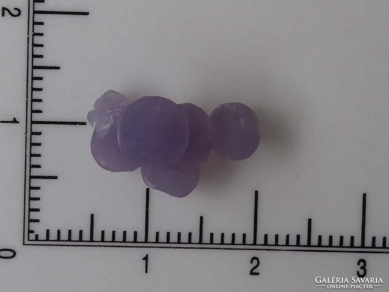 Spherical purple quartz crystals are a natural mineral. (Grape agate).