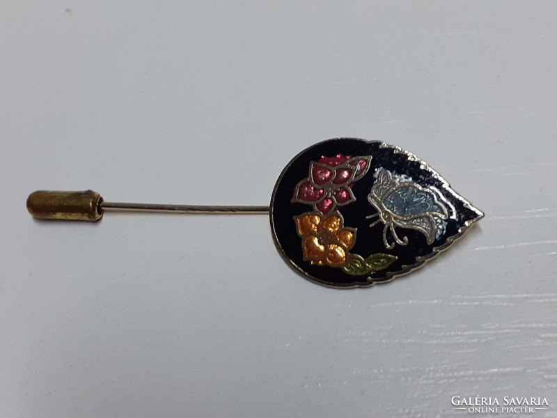 Nice fire enamel with a protective cap on the end of a leaf-shaped hat or tie pin
