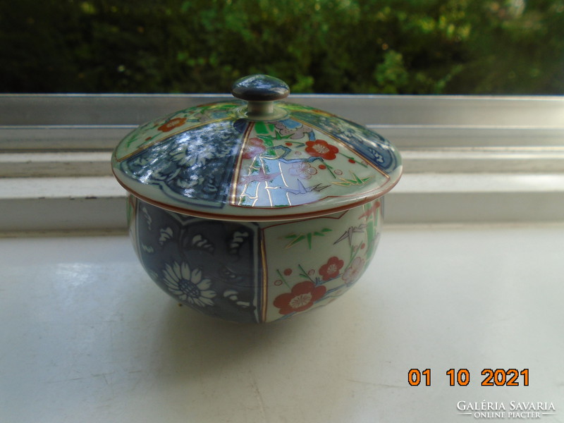 Hand-painted, hand-marked cup with imari and blue white flower patterns on gray jade glaze
