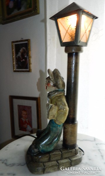 Kurt is a ceramic ceramic: a newsboy boy sculpture lamp