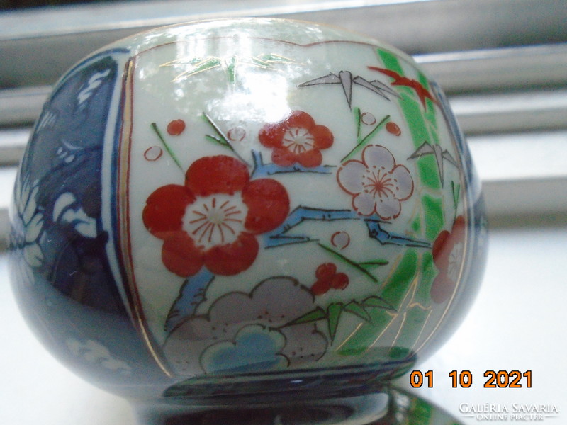 Hand-painted, hand-marked cup with imari and blue white flower patterns on gray jade glaze